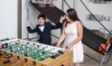 WJC Mitzvahs people playing fooseball